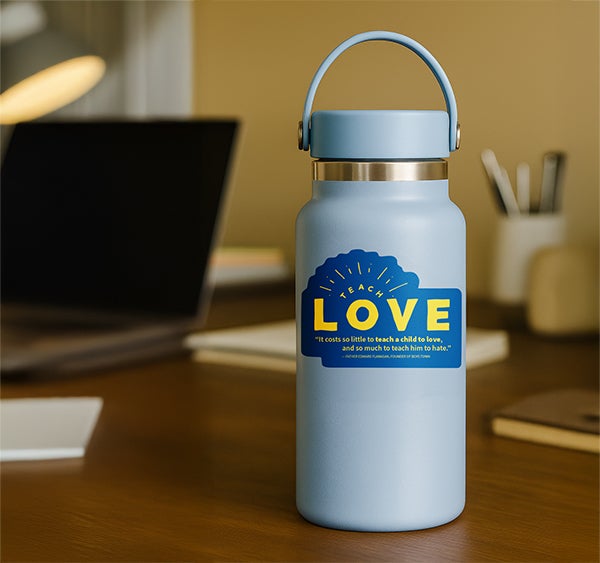 Teach Love sticker on water bottle