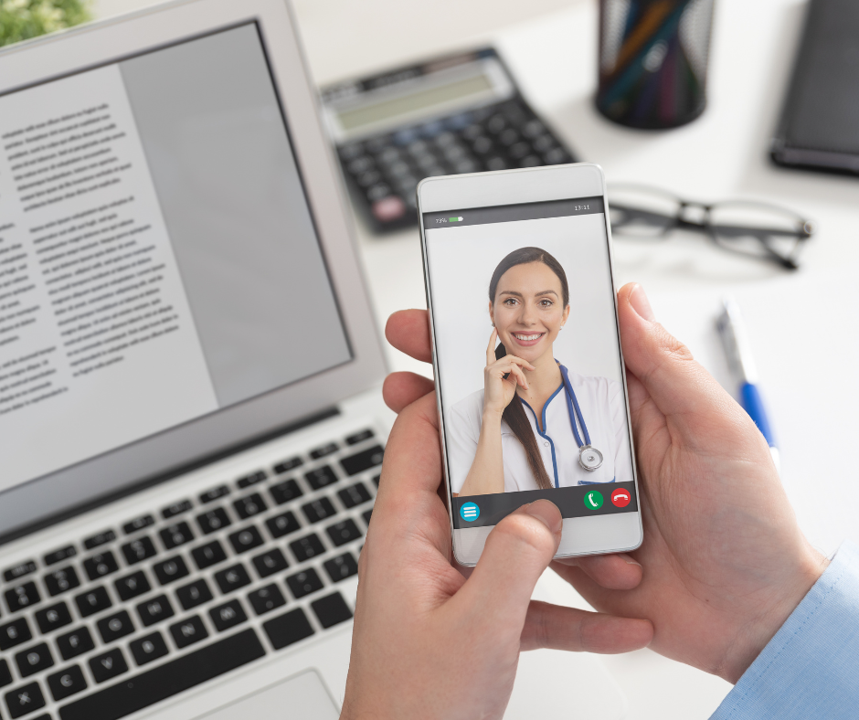 man speaking on phone with telehealth doctor