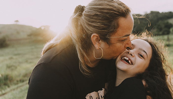 Mom and daughter in field