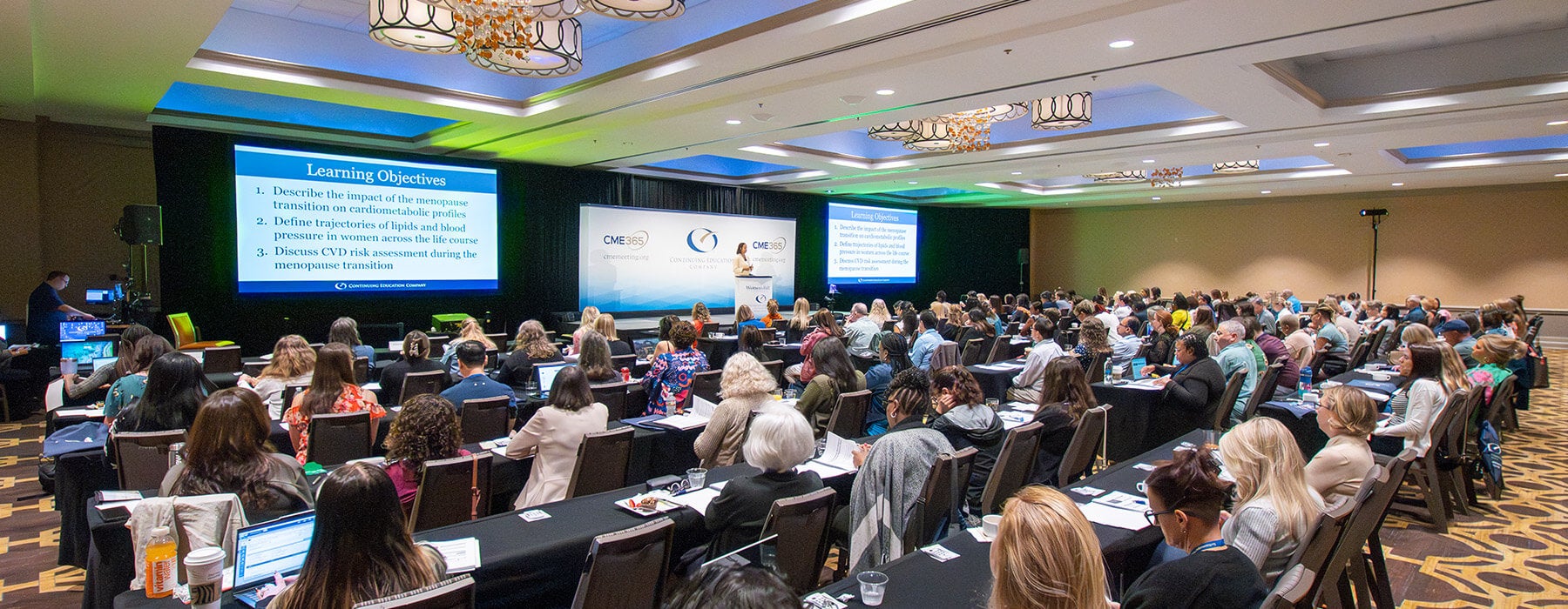 Doctors at CME Conference Listening to Speaker