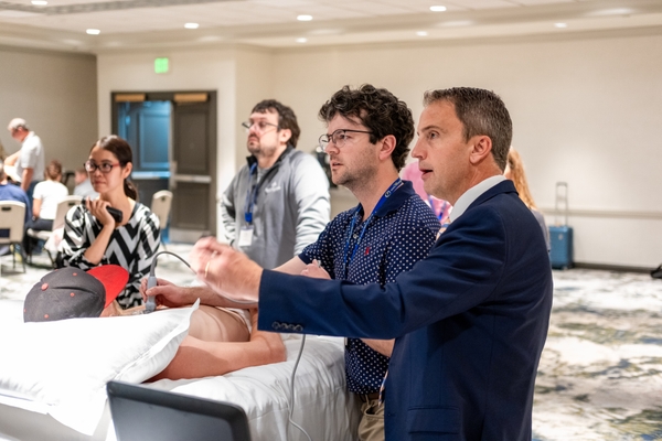 instructor with students at a ultrasound workshop