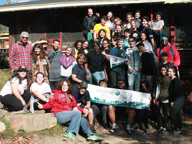 student standing outdoors for a group photo