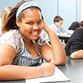 young girl smiling in class