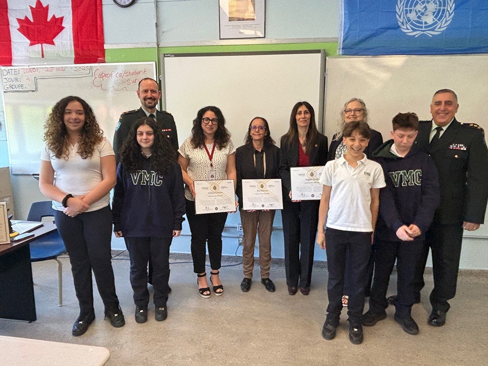 Staff recognized for supporting teacher in his role as Canadian reservist