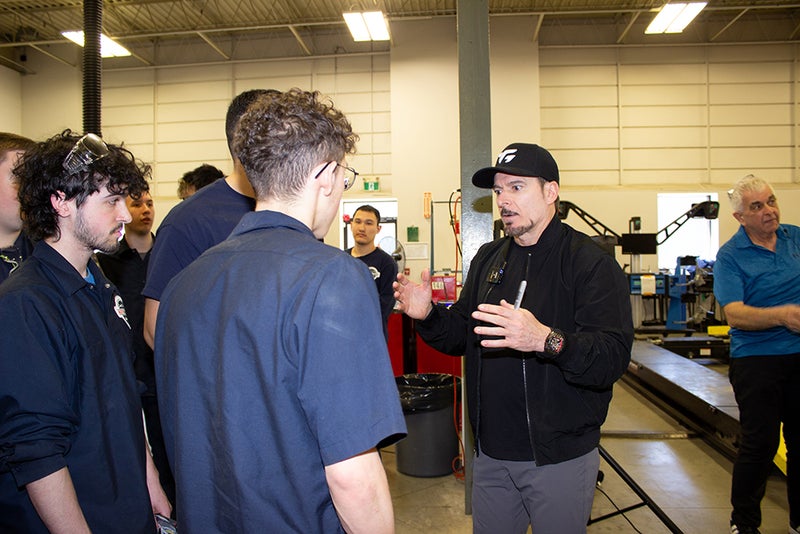 Quebec race car driver Alex Tagliani   pays special visit to LMAC Career Centre and meets with auto-mechanic students and staff