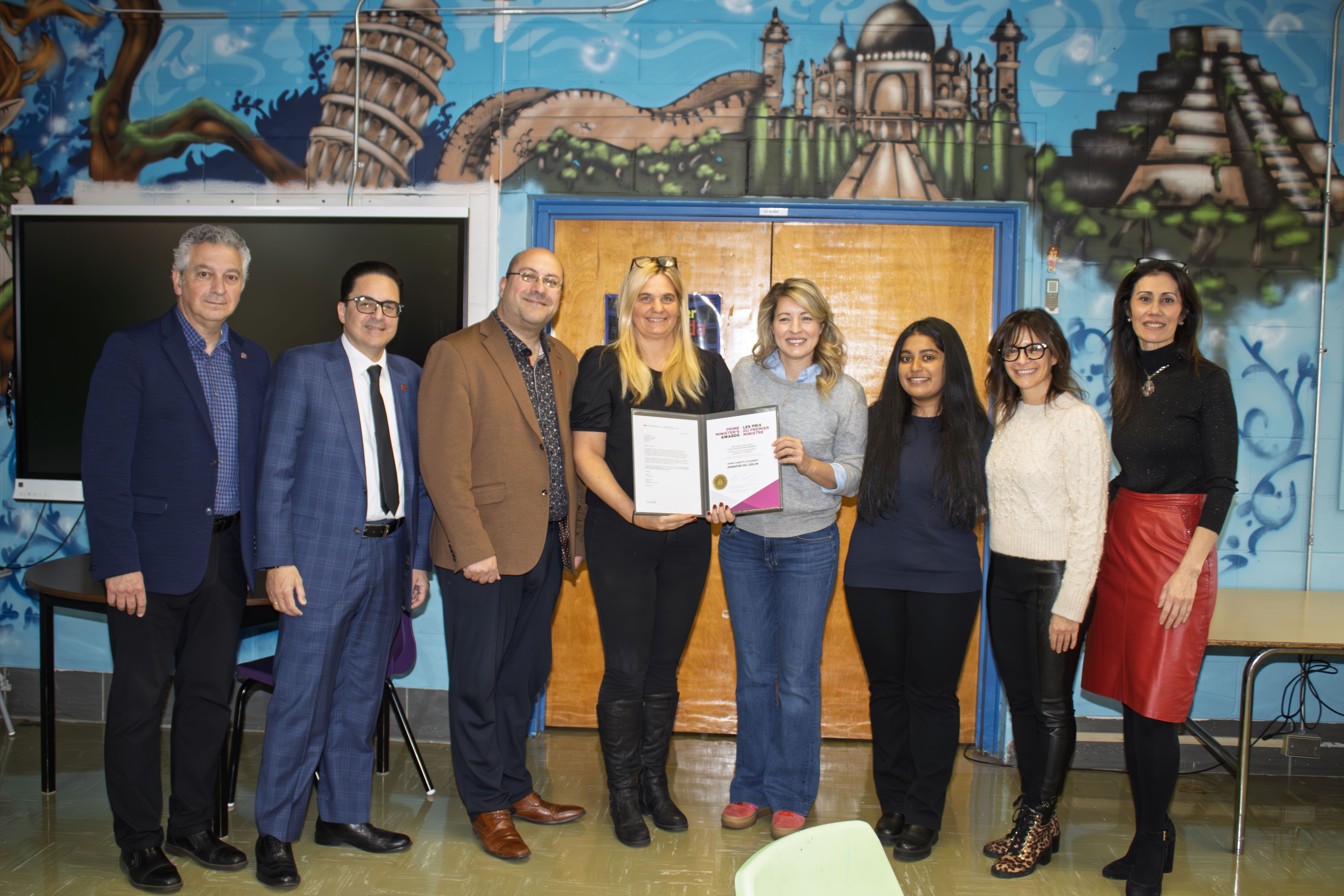 Melanie Joly makes  the presentation to  Jennifer De Leeuw  