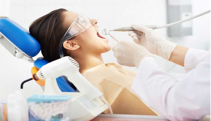 Girl sitting in dentist chair