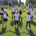Students holding hands outside