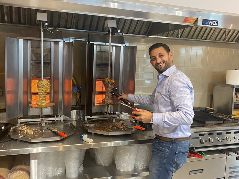 Owner Emad Saad gets behind the counter.