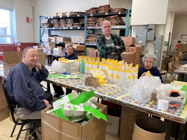 JEM employees, from left: Leslie Perryon, Penny Maria Lee, Andrew Blankfort and Mindy Grill pack and assemble products in the factory on January 30, 2024.
