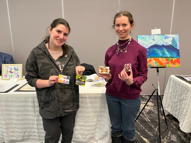  Megan Zelikovic, left, and Sarah Aspler exhibit their artwork at this year’s multigenerational art exhibition “From Strength to Strength” at the Gelber Conference Centre on February 21.