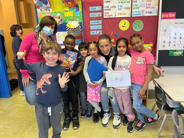 Students in Khalida Smahi’s class at John Caboto Elementary School consult with Simon Chang on their pencil case project on March 28. In front: William. Back, from left: Smahi, students Jaden, Mahid, Emma, Hannah and Layla surround Simon Chang, third from right.