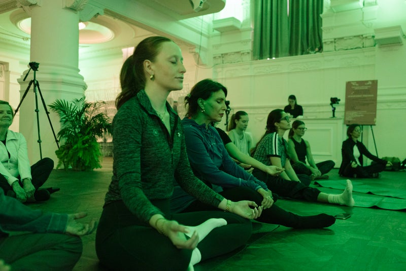 Rise to Wellness attendees enjoy a meditation session led by Susan Homa.