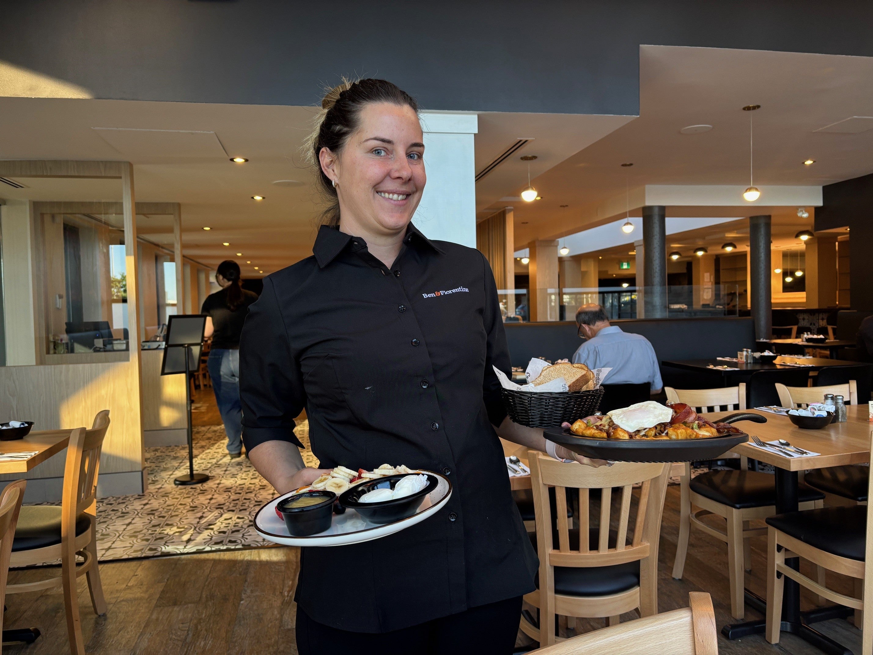Server Jennifer presents the orders at Ben & Florentine.