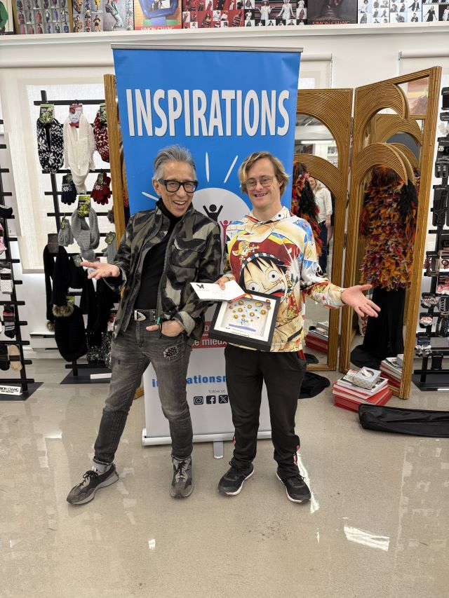 Simon Chang, left, and Matthew Brotherwood during the surprise award ceremony at Chang’s atelier on Chabanel St. on April 29. Photo: Mark Bergman