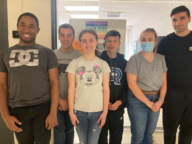 Adam's P.A.C.E. students Donnick Patrice, Johnny Viron, Paige Nimis, Matthew Delellis, Sarah Bouchard and Charles Gkeivelopoulos outside of their classroom at Champlain College on September 28. Photo: Natalie Henri.
