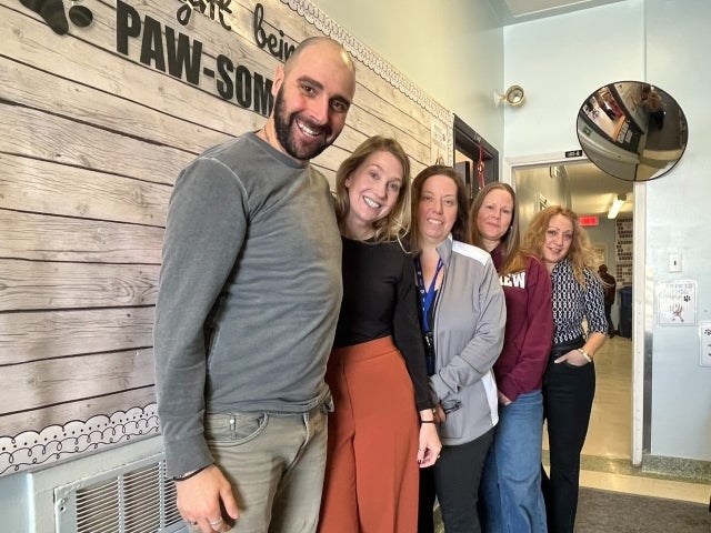 Steven Atme is seen standing with three of Crestview staff: principal Sarah Lefebrvre-Gauthier, Shila Lindsay, specialized education technician, Kimberly Rechil, vice principal and Diana Mastroianni, daycare technician.