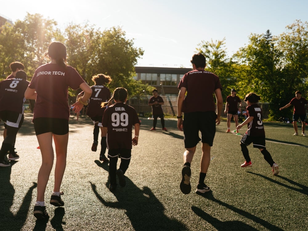Children from the back, playing soccer with the NDG Lions