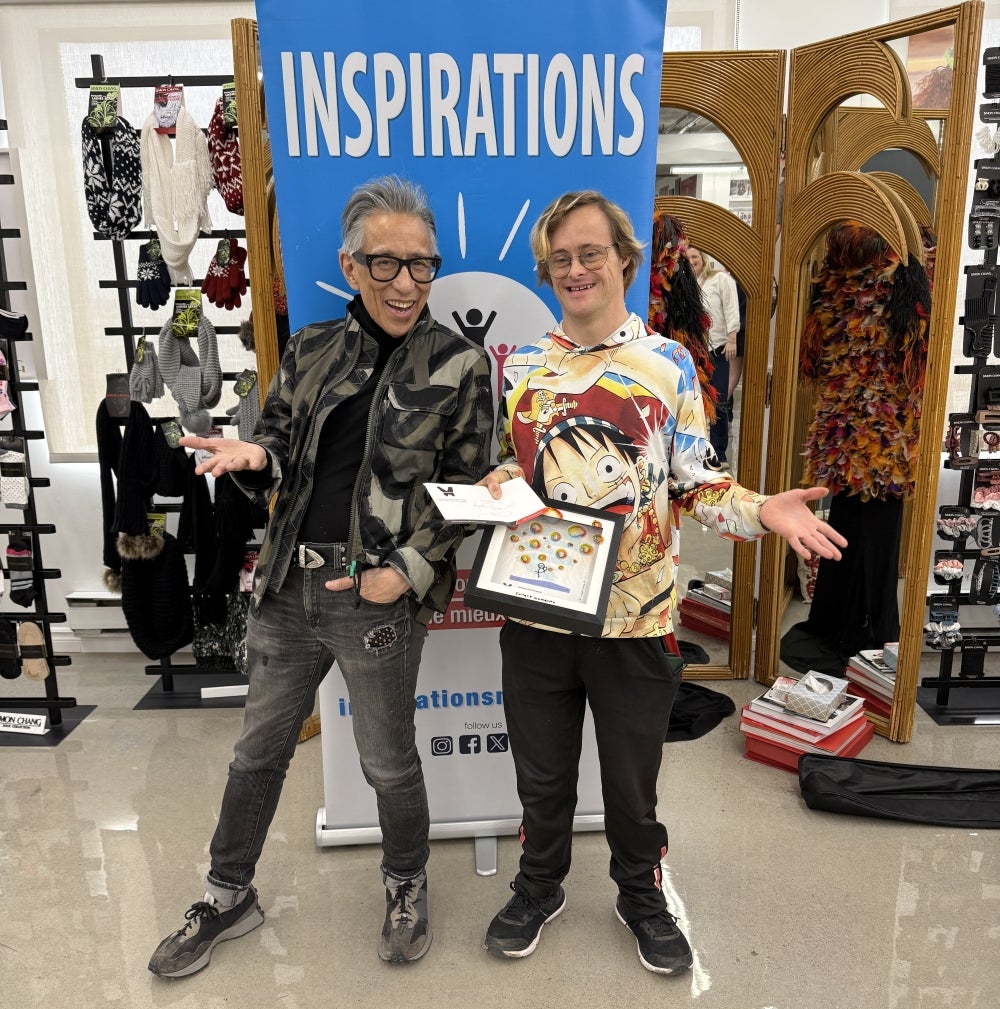 Simon Chang, left, and Matthew Brotherwood during the surprise award ceremony at Chang’s atelier on Chabanel St. on April 29. Photo: Mark Bergman