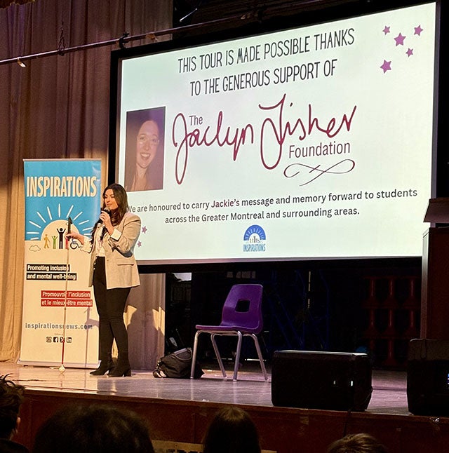 Maryam Ganni presenting with her blinged-up white cane during a White Cane Week 