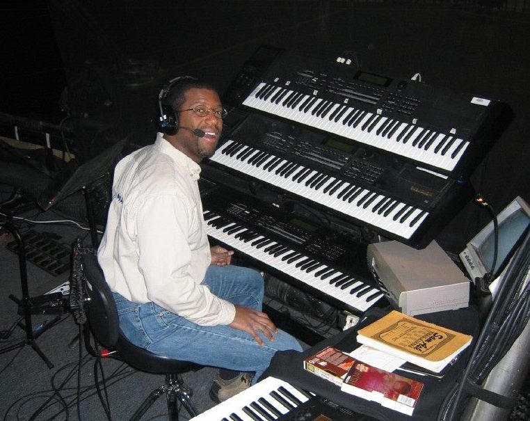 man playing keyboards