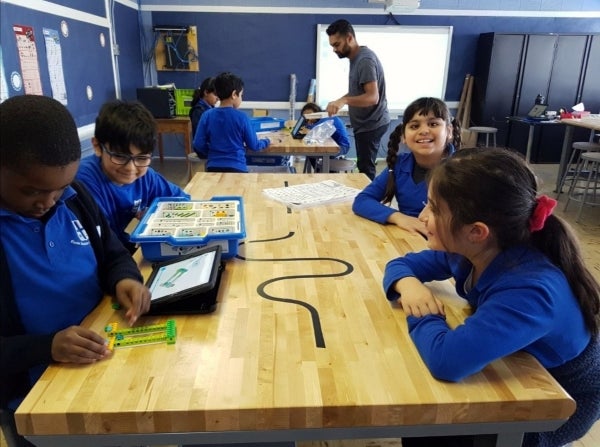 Image showing young students of a local school doing an educational activity together.