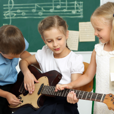 Children playing Guitar