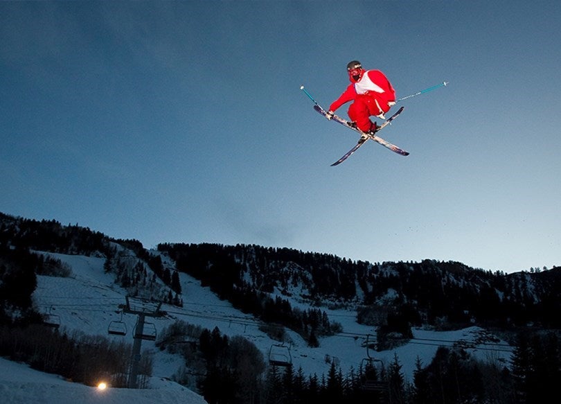 skiier jumping aspen snowmass