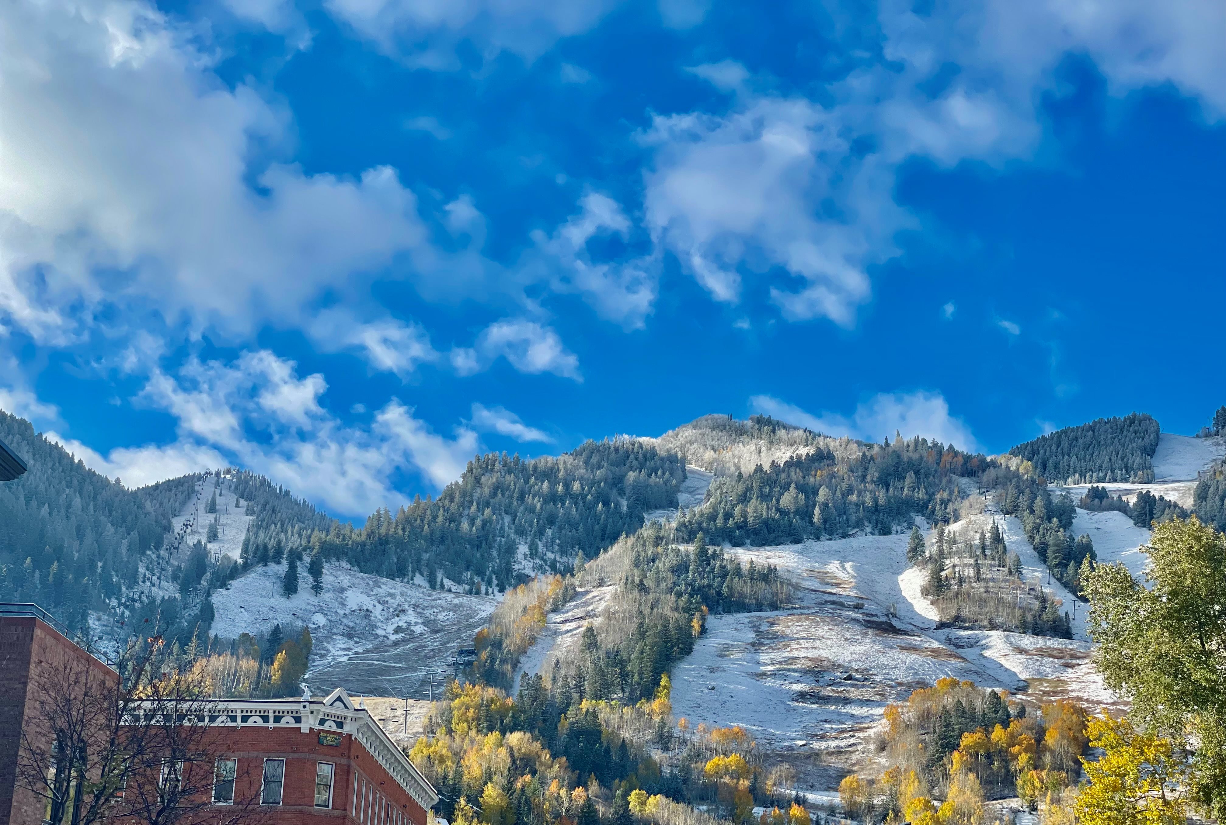 aspen mountain with fall colors and snow