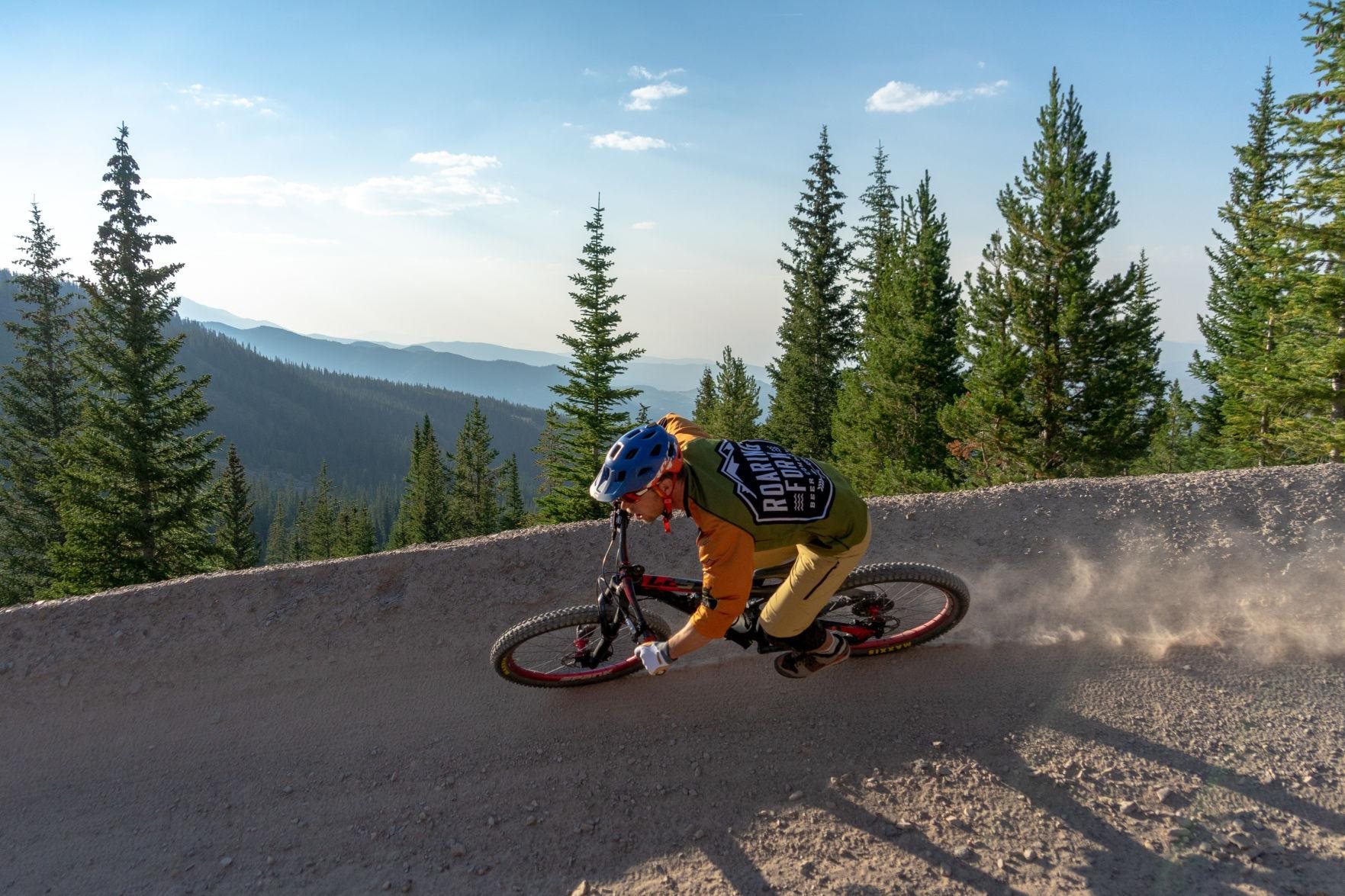 mountain biker on dirt ramp