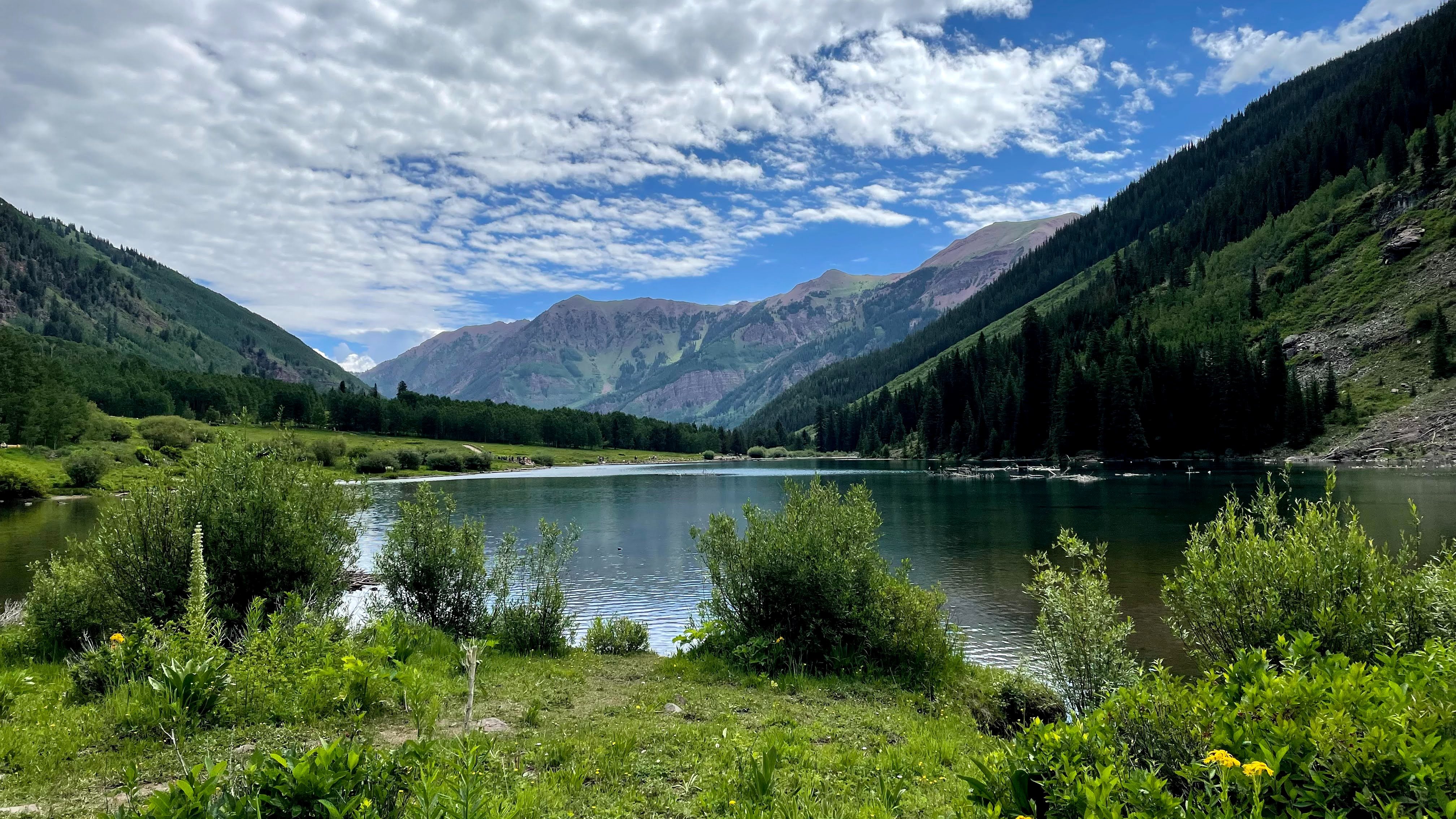 mountain with lake and clouds