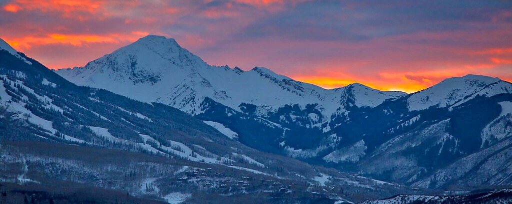 snowmass mountain with orange sunset
