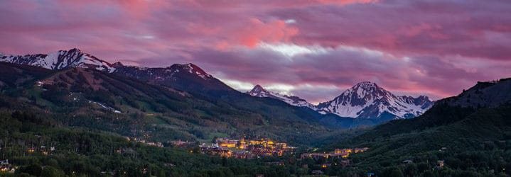 mountains with pink sunset maroon bells