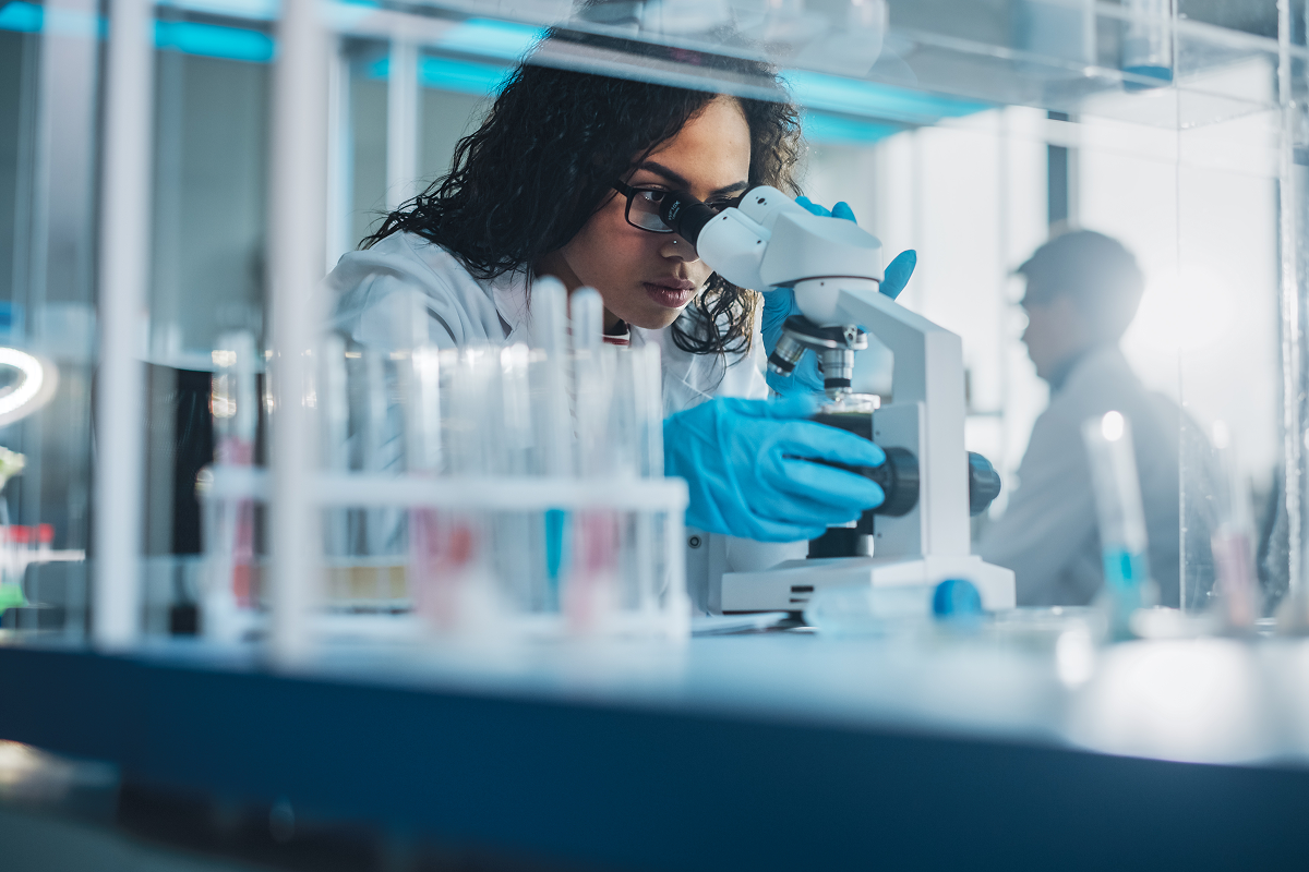 Pharmacist looking in mircoscope