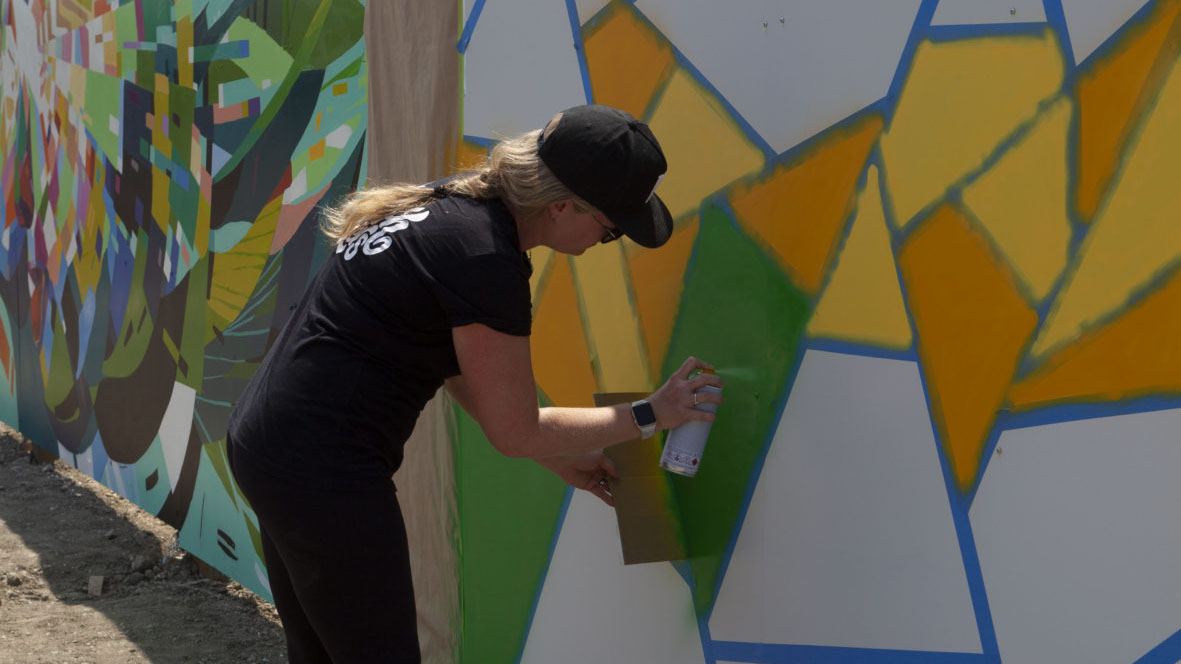 muralist painting at lakeview village
