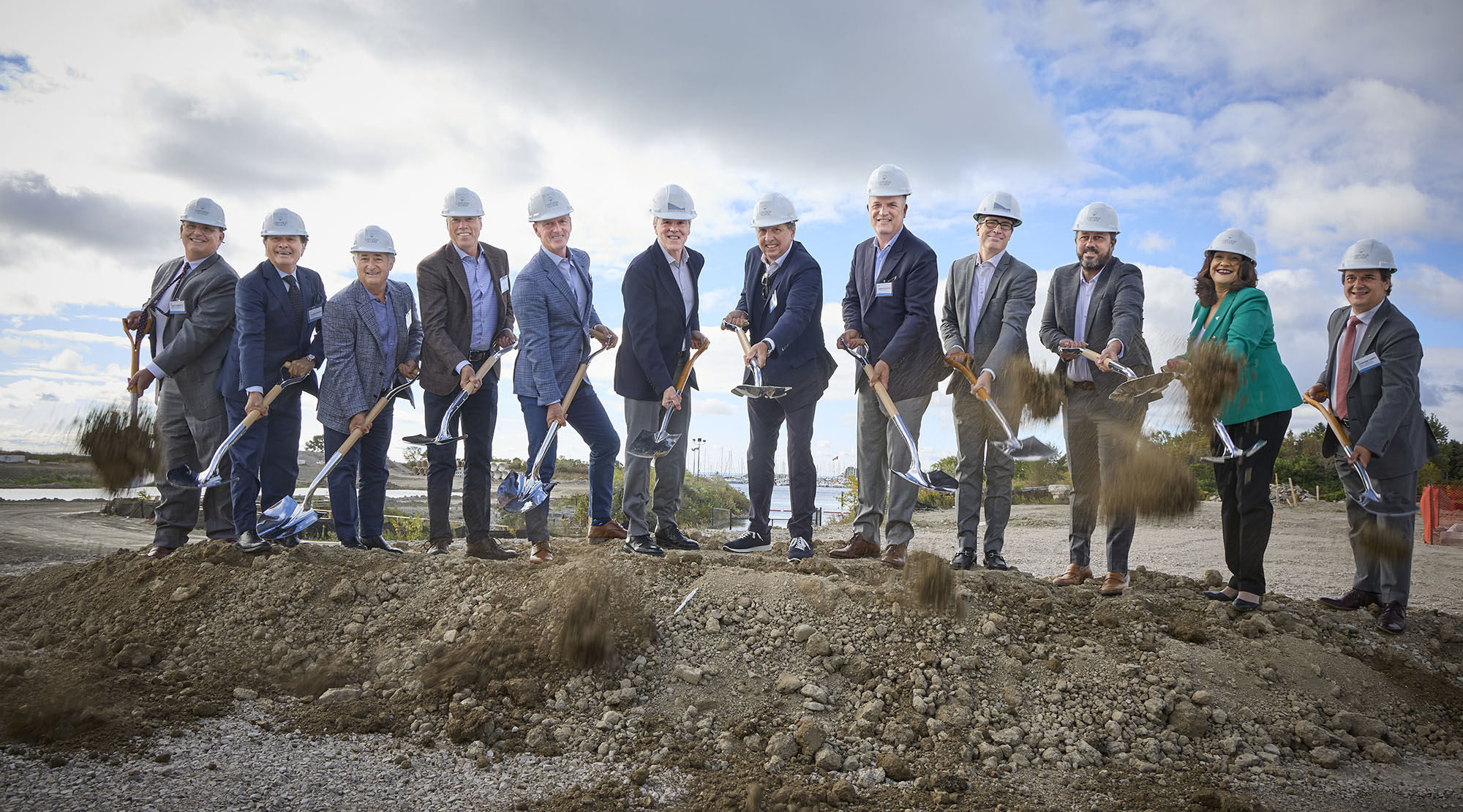 group of people shoveling dirt