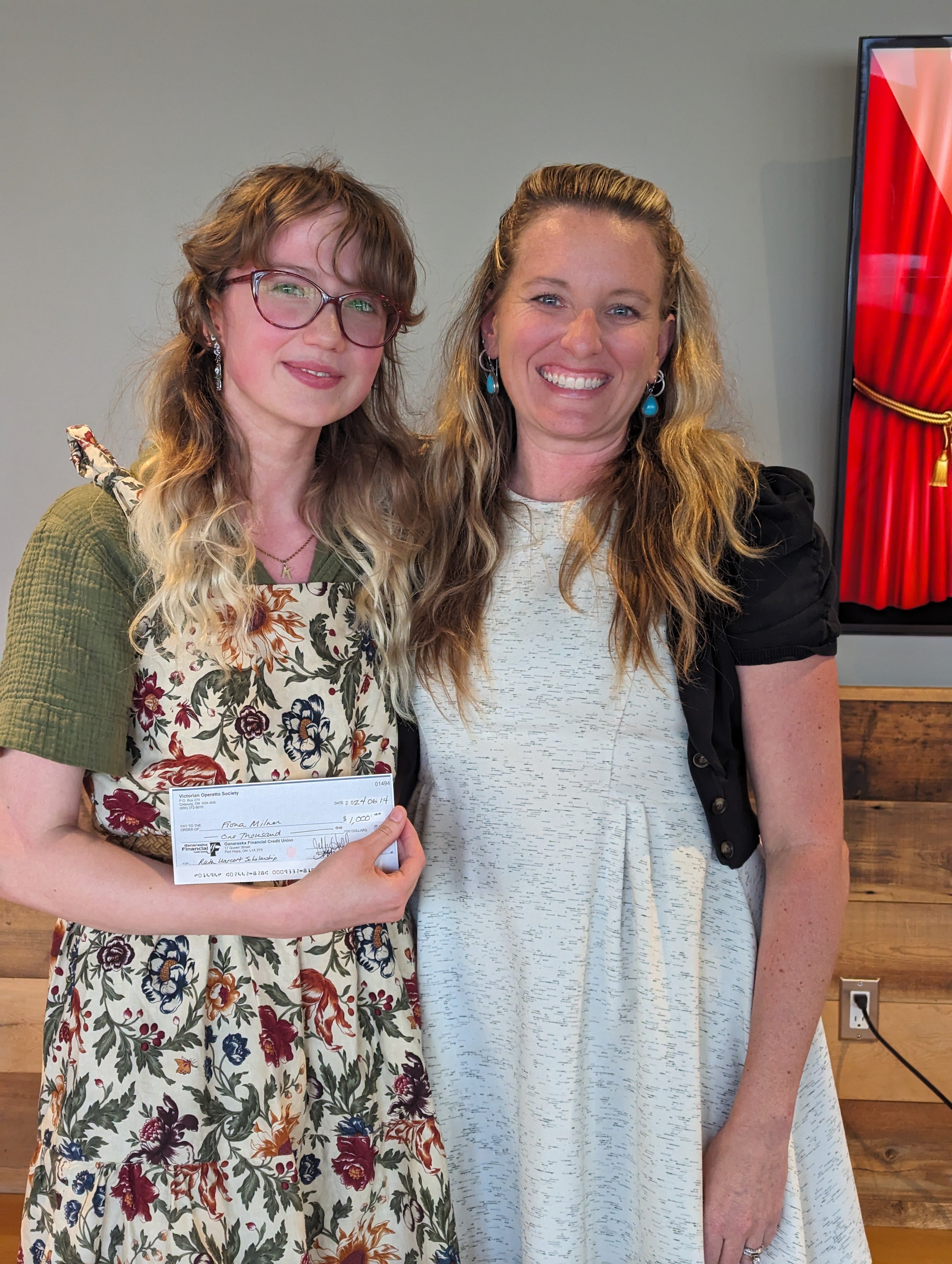 Fiona accepts the cheque from VOS president Meghan Flindall